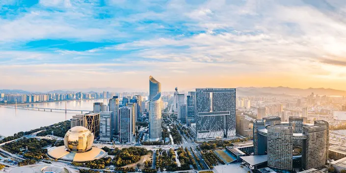 the skyline of modern Hangzhou at dawn with skyscrapers