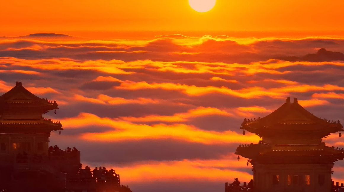 Sunrise bathes Laojun Mountain in golden light and creates a dazzling scene