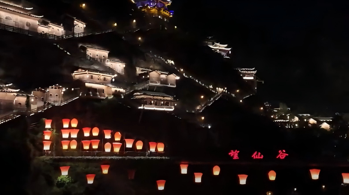 Illuminated buildings on the cliffs radiate a dreamlike charm at night in east China’s Shangrao